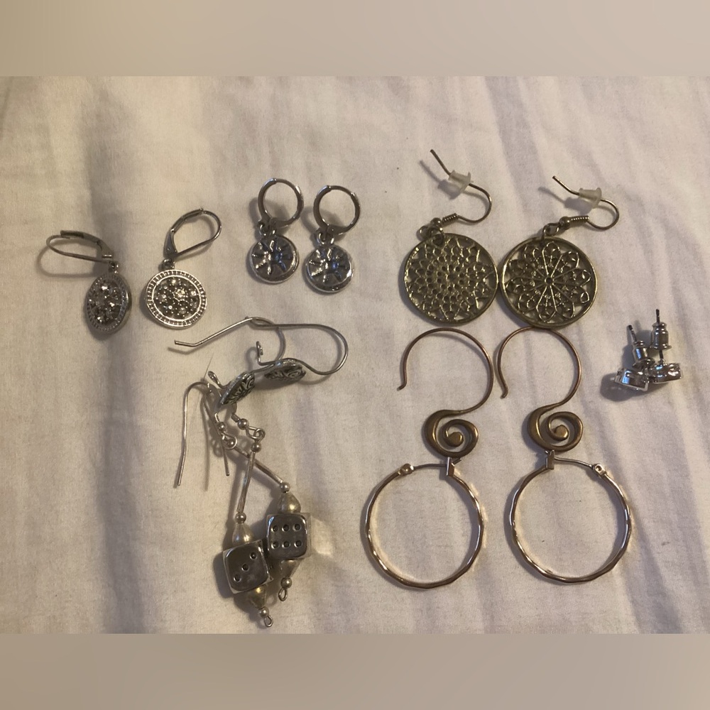 Eight Earrings Of Different Colored And Sizes